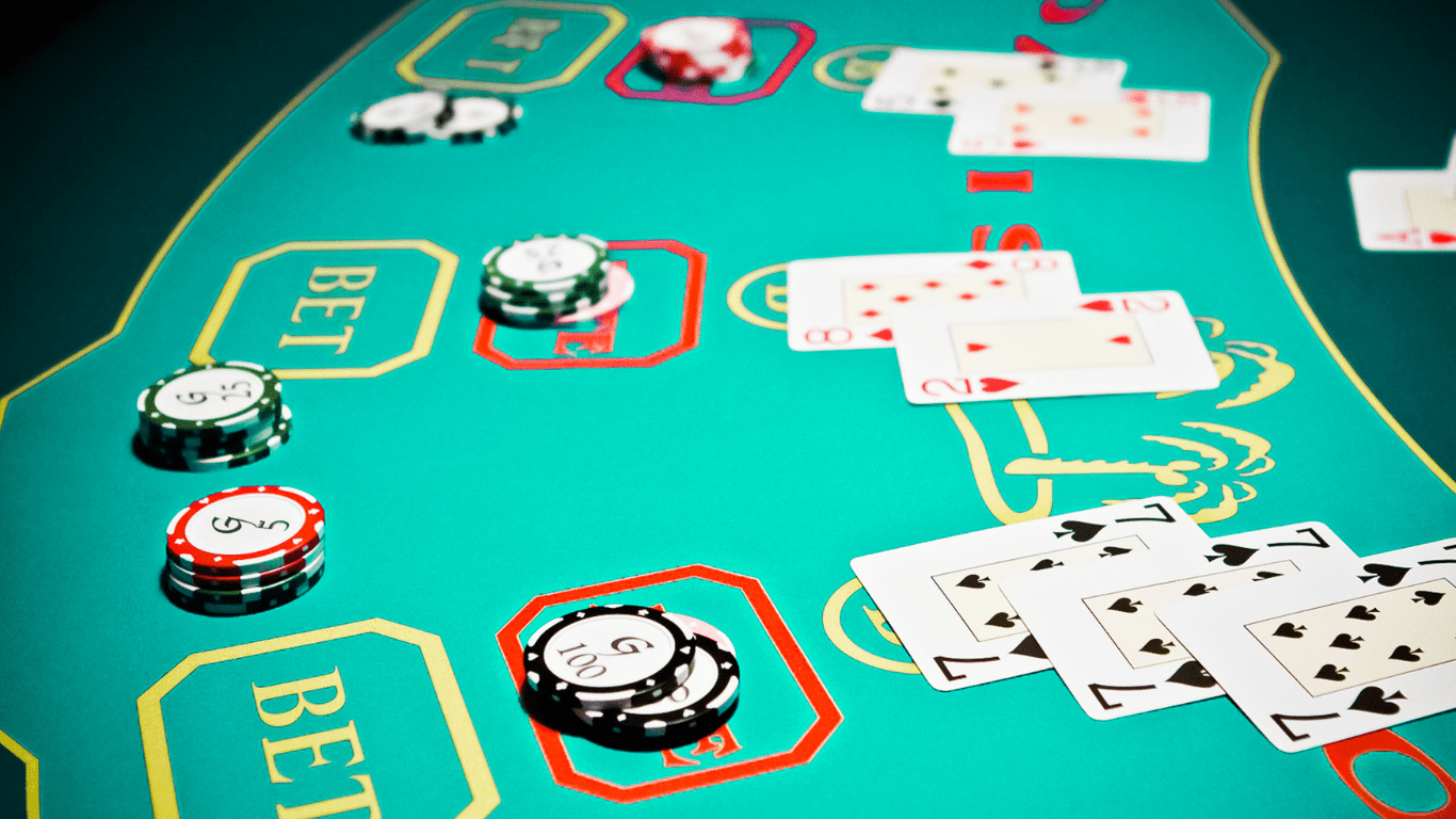 a casino table with poker chips and cards