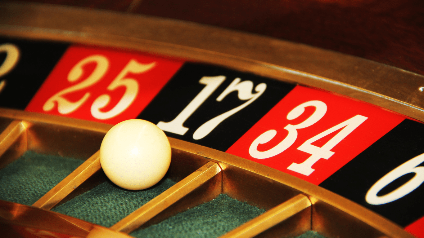 a close up of a roulette wheel on a casino table