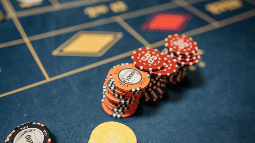 a casino table with chips and a roulette wheel