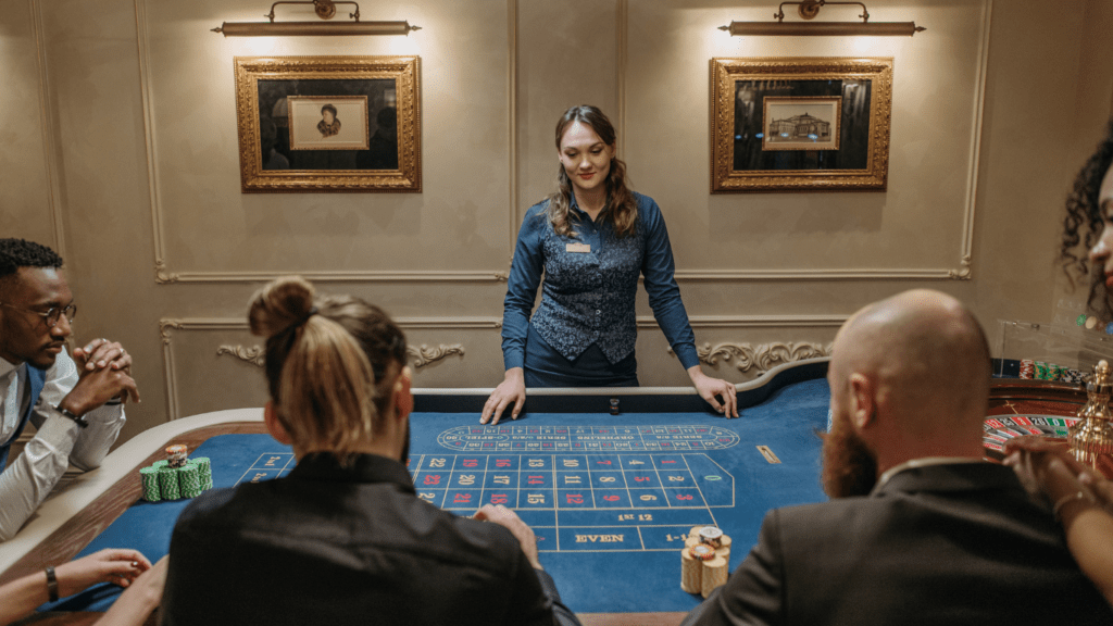 a group of people playing roulette at a casino