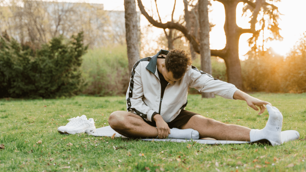 a person doing yoga in the park