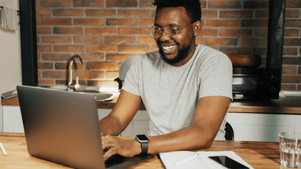 a person typing on a laptop computer