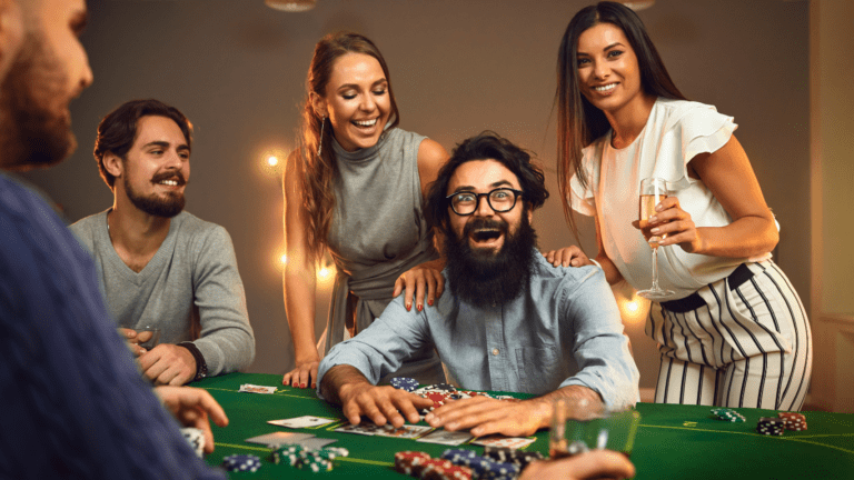 excited poker winner sitting at casino table