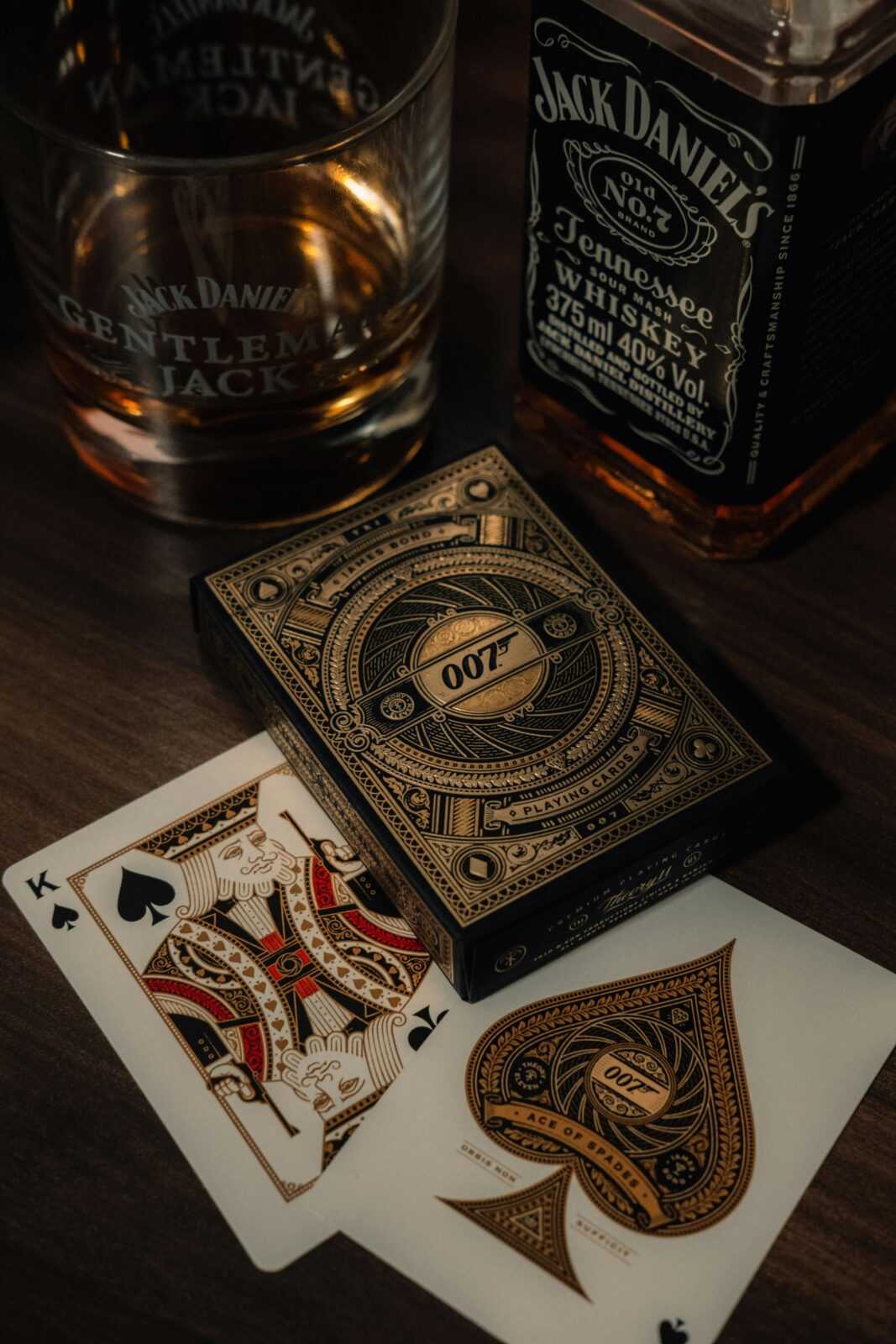 Playing Cards by Jack Daniels Whiskey Bottle